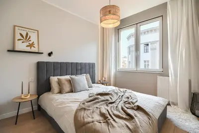 Łóżko lub łóżka w pokoju w obiekcie Stawowa Apartment - Self Check-In 20h