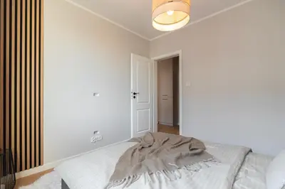 Łóżko lub łóżka w pokoju w obiekcie Stawowa Apartment - Self Check-In 20h
