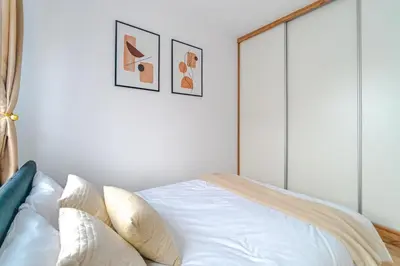 Łóżko lub łóżka w pokoju w obiekcie Apartament z tarasem PW INVEST HOME