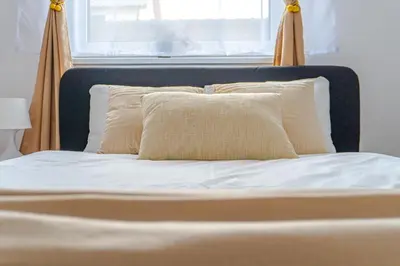 Łóżko lub łóżka w pokoju w obiekcie Apartament z tarasem PW INVEST HOME