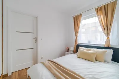 Łóżko lub łóżka w pokoju w obiekcie Apartament z tarasem PW INVEST HOME