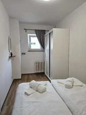 Łóżko lub łóżka w pokoju w obiekcie Sunny apartment 3 minutes walk from Rynek square