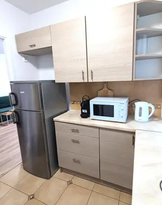 Kuchnia lub aneks kuchenny w obiekcie Sunny apartment 3 minutes walk from Rynek square