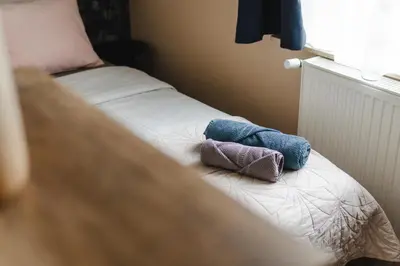 Łóżko lub łóżka w pokoju w obiekcie Słoneczny Apartament