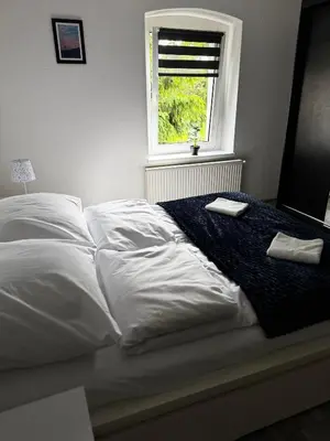 Łóżko lub łóżka w pokoju w obiekcie Apartament u Gąbki