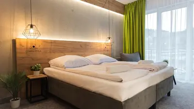 Łóżko lub łóżka w pokoju w obiekcie VacationClub - Czarna Perła Apartament 514
