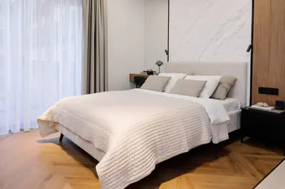 Łóżko lub łóżka w pokoju w obiekcie NeroLux Apartment