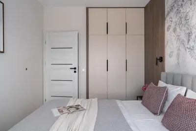 Łóżko lub łóżka w pokoju w obiekcie INA Rent - Apartamenty Mieszczanska