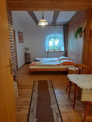 Łóżko lub łóżka w pokoju w obiekcie Lipowy Dwór