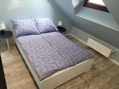 Łóżko lub łóżka w pokoju w obiekcie Apartament Chabrowy