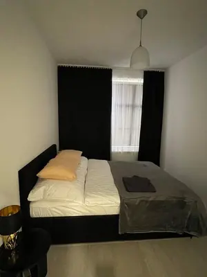 Łóżko lub łóżka w pokoju w obiekcie Apartament 4 Wolności