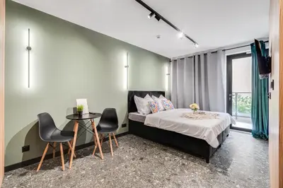 Łóżko lub łóżka w pokoju w obiekcie Muzealna Residence