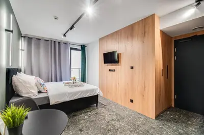 Łóżko lub łóżka w pokoju w obiekcie Muzealna Residence