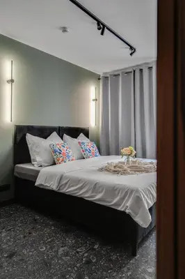 Łóżko lub łóżka w pokoju w obiekcie Muzealna Residence