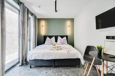 Łóżko lub łóżka w pokoju w obiekcie Muzealna City Stay
