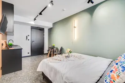 Łóżko lub łóżka w pokoju w obiekcie Muzealna City Stay