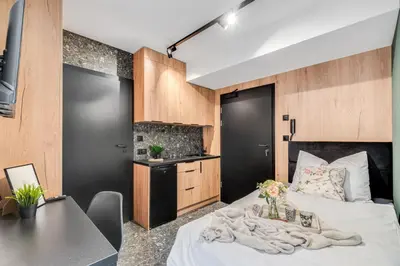 Łóżko lub łóżka w pokoju w obiekcie Muzealna Business Rooms