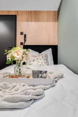Łóżko lub łóżka w pokoju w obiekcie Muzealna Business Rooms