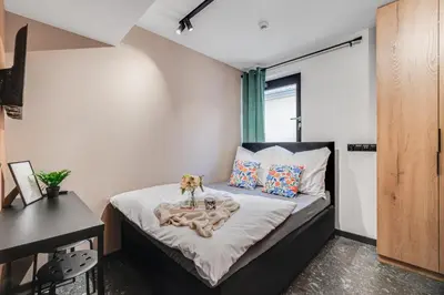 Łóżko lub łóżka w pokoju w obiekcie Muzealna Business Rooms
