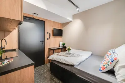 Łóżko lub łóżka w pokoju w obiekcie Muzealna Business Rooms