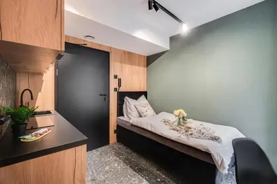 Łóżko lub łóżka w pokoju w obiekcie Muzealna Business Rooms
