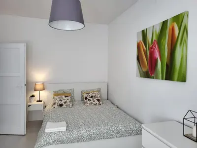 Łóżko lub łóżka w pokoju w obiekcie Apartament Piastowska
