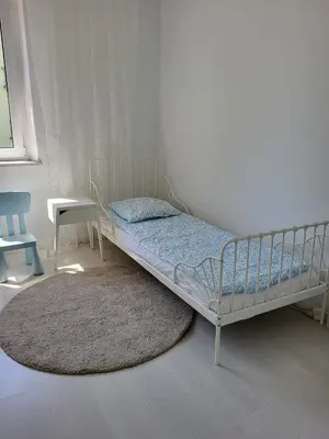 Łóżko lub łóżka w pokoju w obiekcie Apartament Piastowska