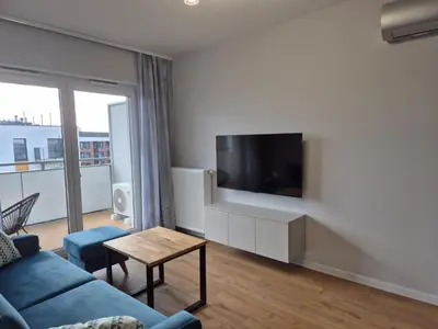 Telewizja i/lub zestaw kina domowego w obiekcie Apartamenty Kępa Mieszczańska