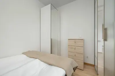 Łóżko lub łóżka w pokoju w obiekcie Cozy Apartment Wrocław with Garage Access by Noclegi Renters