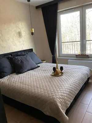 Łóżko lub łóżka w pokoju w obiekcie Apartament Zielona Dzielnica