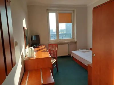 Łóżko lub łóżka w pokoju w obiekcie Dom Studencki Rubin