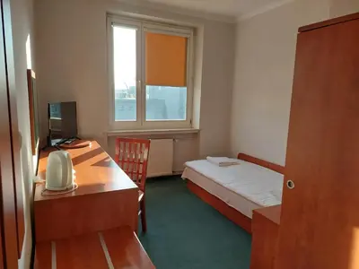 Łóżko lub łóżka w pokoju w obiekcie Dom Studencki Rubin