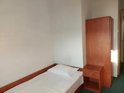 Łóżko lub łóżka w pokoju w obiekcie Dom Studencki Rubin