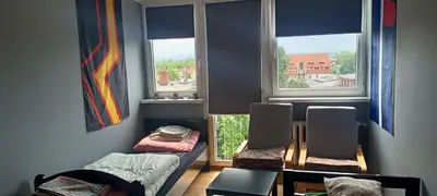Łóżko lub łóżka w pokoju w obiekcie Apartament Asmodeusz