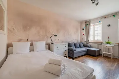 Łóżko lub łóżka w pokoju w obiekcie RentPlanet - Studio Rynek Ratusz