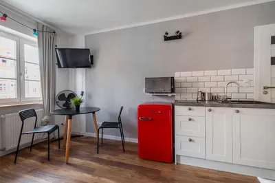 Kuchnia lub aneks kuchenny w obiekcie RentPlanet - Studio Rynek Ratusz