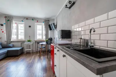 Kuchnia lub aneks kuchenny w obiekcie RentPlanet - Studio Rynek Ratusz