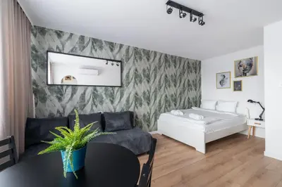 Łóżko lub łóżka w pokoju w obiekcie RentPlanet - Studio Kazimierza Wielkiego