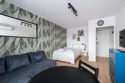 Łóżko lub łóżka w pokoju w obiekcie RentPlanet - Studio Kazimierza Wielkiego