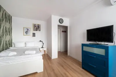 Łóżko lub łóżka w pokoju w obiekcie RentPlanet - Studio Kazimierza Wielkiego