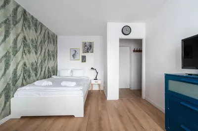 Łóżko lub łóżka w pokoju w obiekcie RentPlanet - Studio Kazimierza Wielkiego