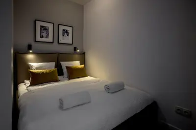 Łóżko lub łóżka w pokoju w obiekcie RentPlanet - Apartamenty Krawiecka
