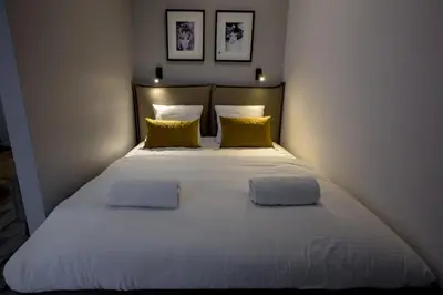 Łóżko lub łóżka w pokoju w obiekcie RentPlanet - Apartamenty Krawiecka