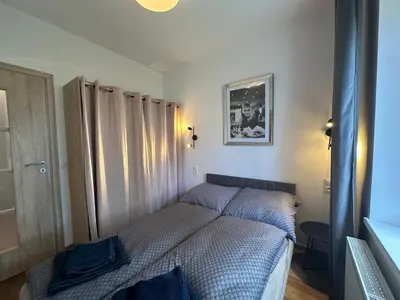 Łóżko lub łóżka w pokoju w obiekcie Sukces Apartament przy deptaku