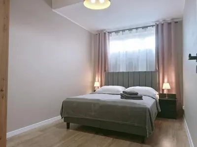 Łóżko lub łóżka w pokoju w obiekcie Apartament z Widokiem, wygodny Apartament z sypialnią, kuchnią i salonem, 47m2, bezpłatny garaż