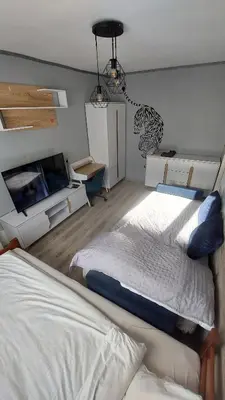 Łóżko lub łóżka w pokoju w obiekcie MagMar Studio Byczyna