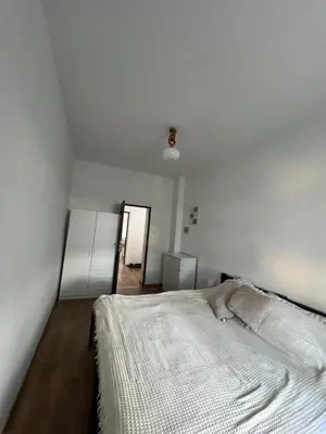Łóżko lub łóżka w pokoju w obiekcie Apartament Wolności