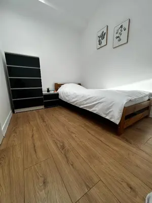 Łóżko lub łóżka w pokoju w obiekcie Loft Apartments Bielawa 
