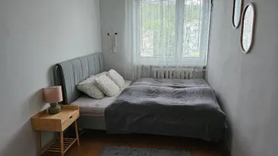 Łóżko lub łóżka w pokoju w obiekcie Apartament RYŚ Polanica Zdrój