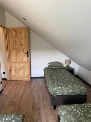 Łóżko lub łóżka w pokoju w obiekcie Domek Na Miodowej